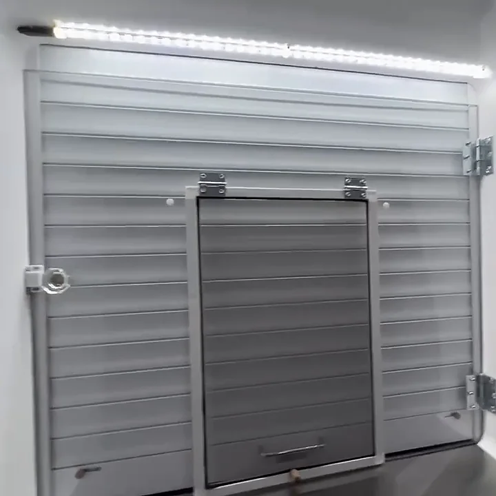 A spotless serving window inside the bus, with its new screen door and LED light