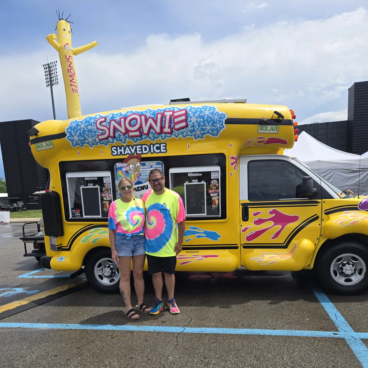 Owner Tonia Reid and family in front of the bus at Columbus Taco Fest
